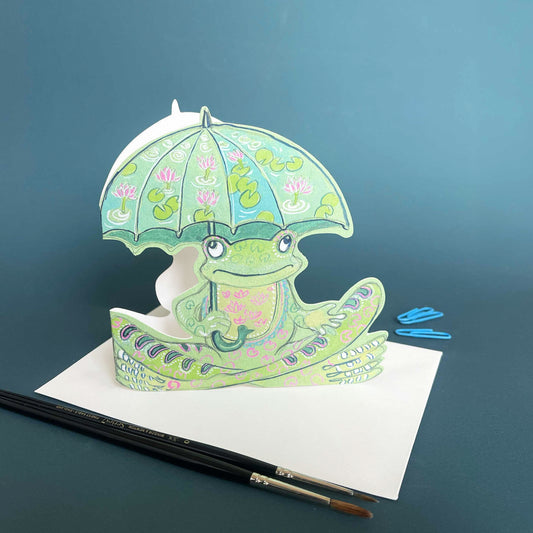 Frog with an umbrella illustrated die cut greetings card