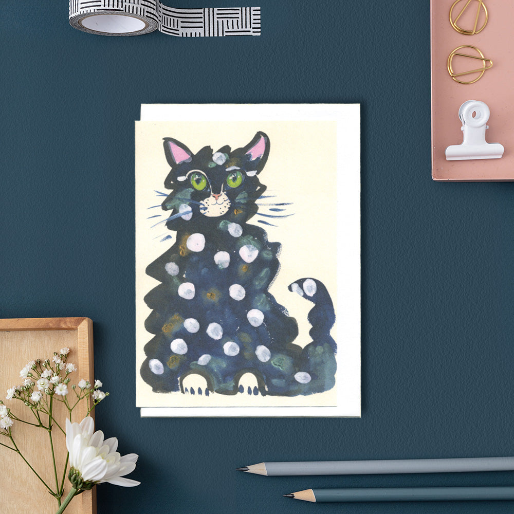Greetings Card of a blue cat with a white polka dot pattern 