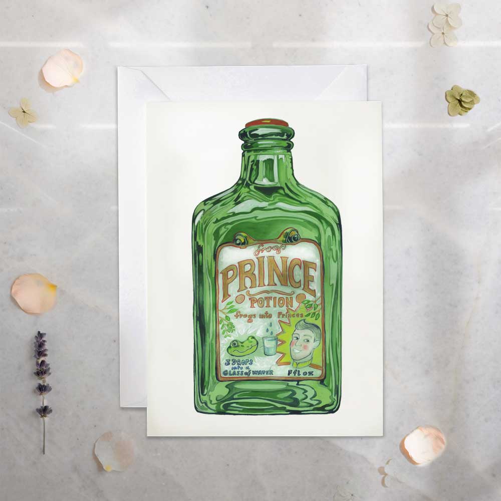 Green bottle with 'Prince potion- frogs to princes' label on a white card against a textured gray background.