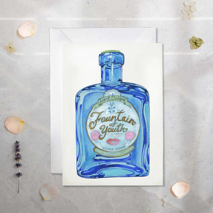 Greeting card Fountain of youth - Tonic Blue bottle design on a textured surface.