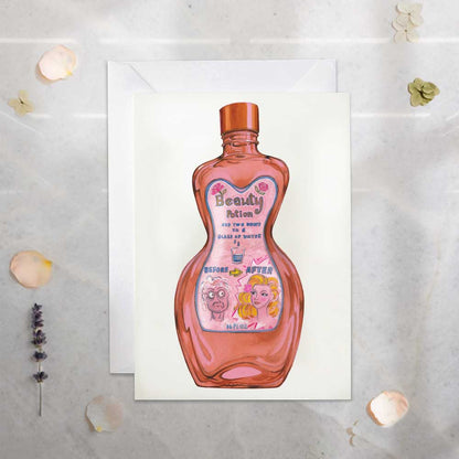 Greeting card with a bottle of 'Beauty Potion' on a textured surface.
