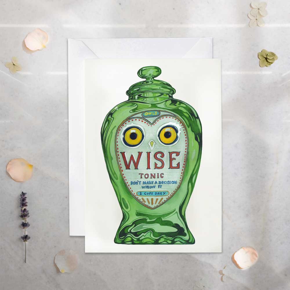 Green bottle with owl design and 'WISE Tonic' text on a textured surface.